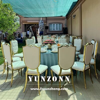 Prezzo buono Nuova sedia da hotel con telaio in acciaio inossidabile a forma di testa di gatto, forniture per mobili, sedia da evento in pelle bianca, sedia da festa dorata con garanzia in linea